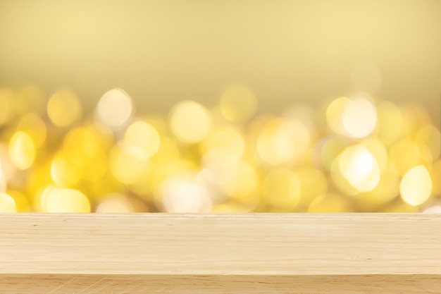 Christmas holiday golden background with empty wooden deck table over winter bokeh. ready for product montage