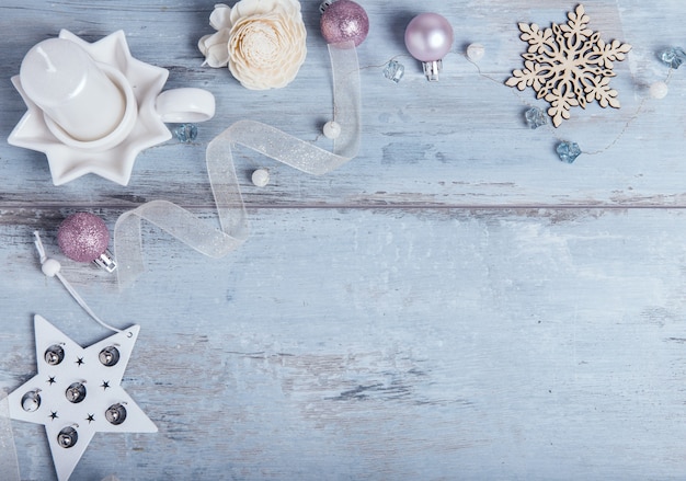 Christmas, new year frame composition.christmas blue decorations on blue wooden background with empty copy space for text. holiday and celebration concept, postcard or invitation. top view. flat lay