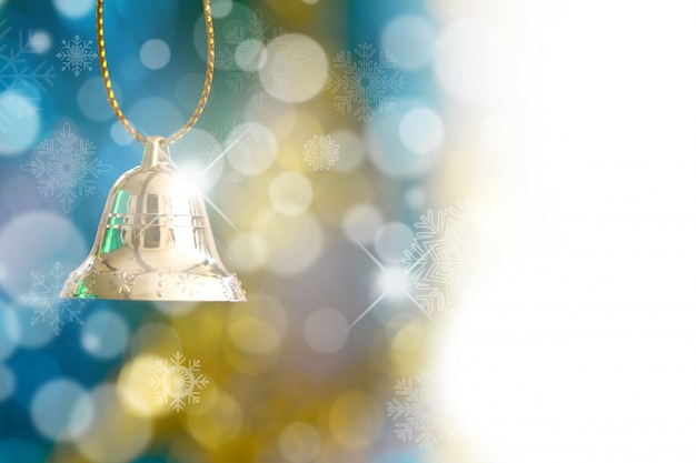 Christmas ornament with bell and bokeh background