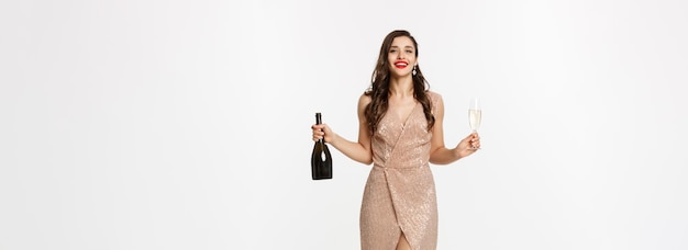 Christmas party and celebration concept full length of elegant woman with red lips luxury dress hold