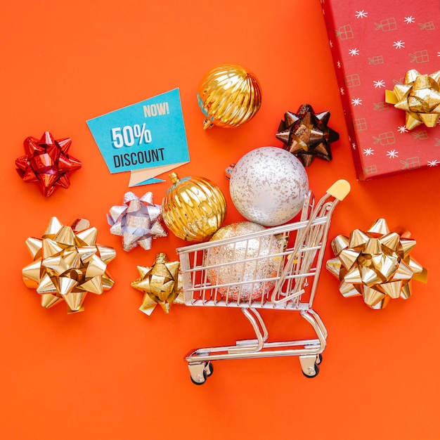 Christmas shopping concept with balls in cart