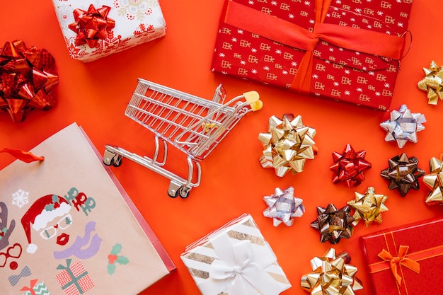 Christmas shopping concept with cart and bag