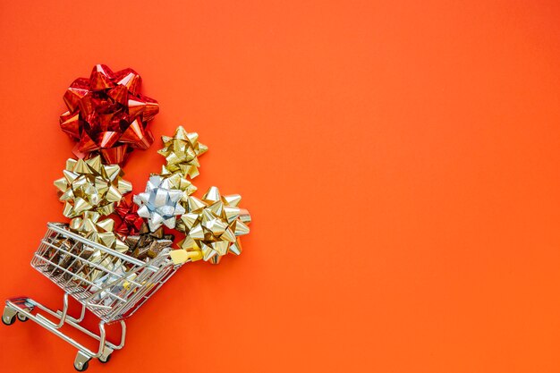 Christmas shopping concept with flowers in cart