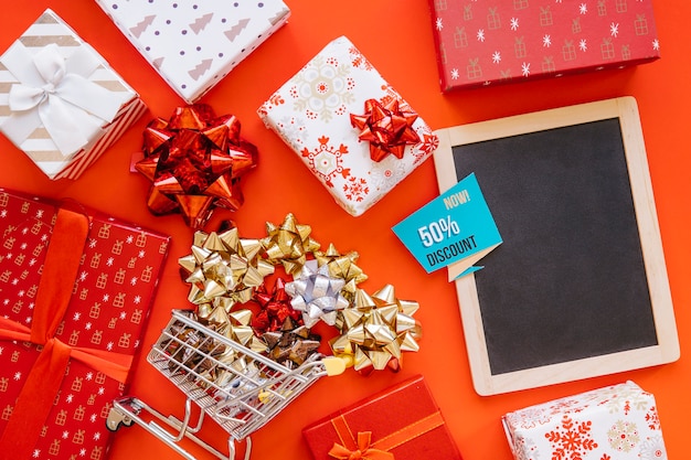 Christmas shopping concept with slate and gifts