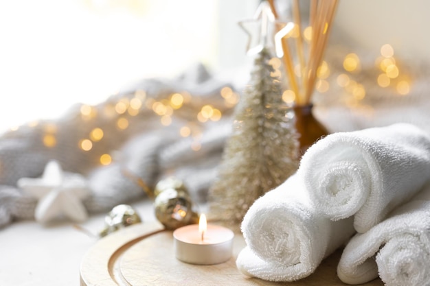 Free photo christmas spa composition on a blurred background with bokeh lights