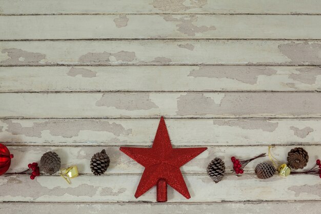 Christmas star with pine cones around