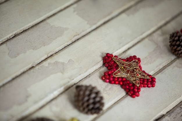 Free photo christmas star with pine cones around