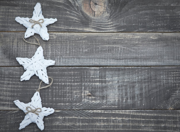 Christmas stars on wooden planks