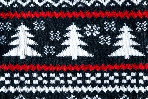 Christmas sweater with red details flat lay