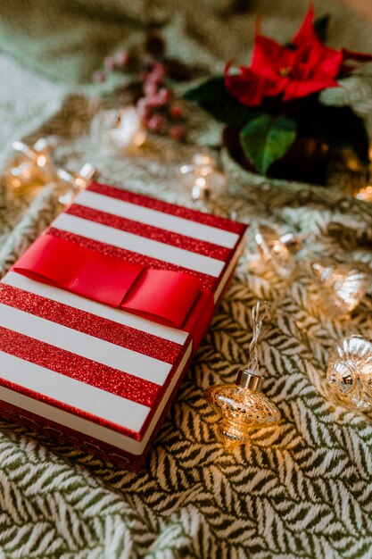 Christmas themed gift box with a poinsettia