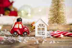 Free photo christmas toy car and details of christmas decor on a blurred background