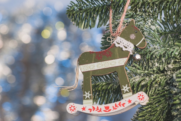 Free photo christmas tree decoration with horse shape close up