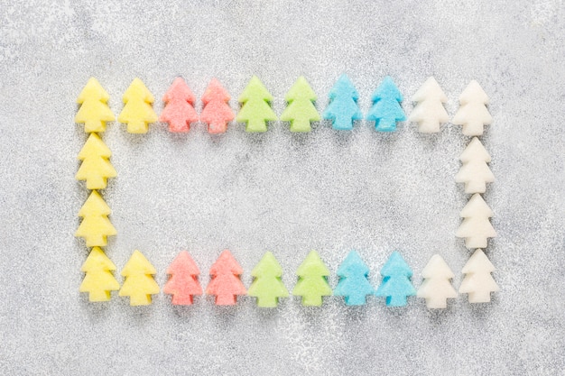 Free photo christmas tree shaped colorful sugars.