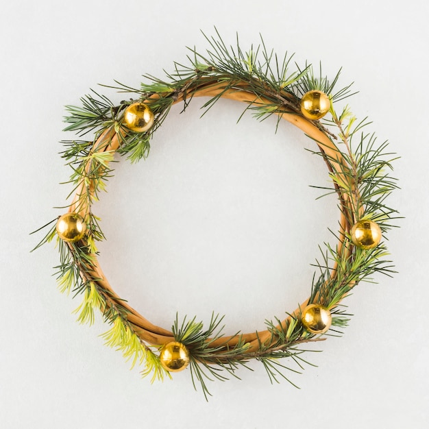 Christmas wreath on white table