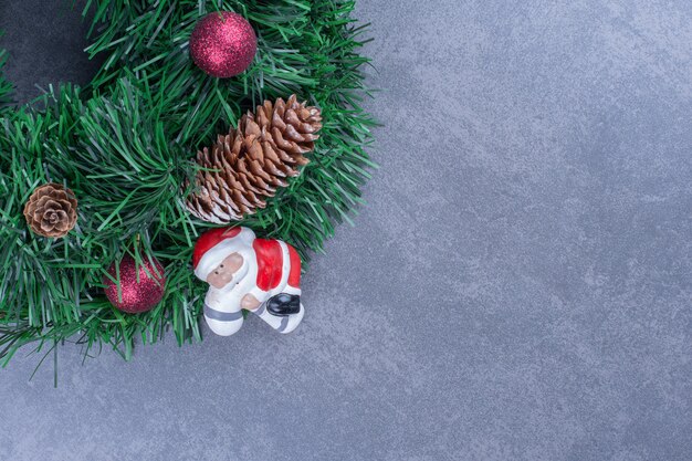 A Christmas wreath with Santa Claus toy