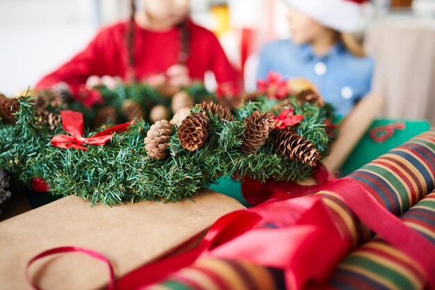 Christmas wreath and wrapping paper closeup