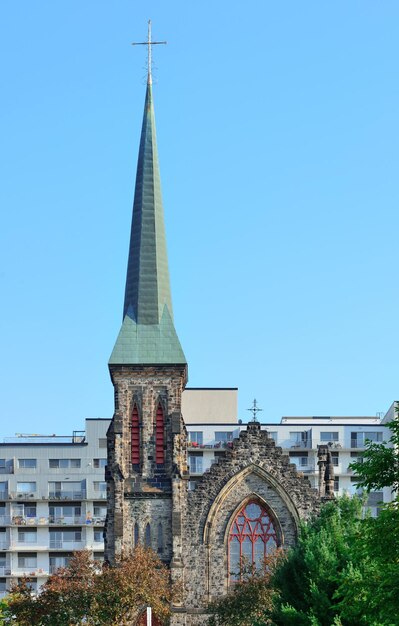 Church on Ottawa street with urban buildings in park