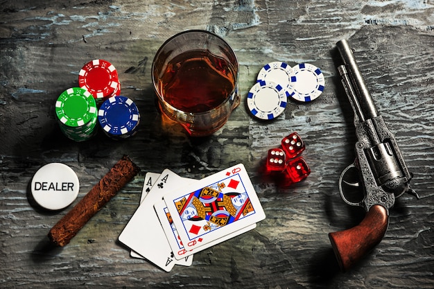 Cigar, chips for gamblings, drink and playing cards