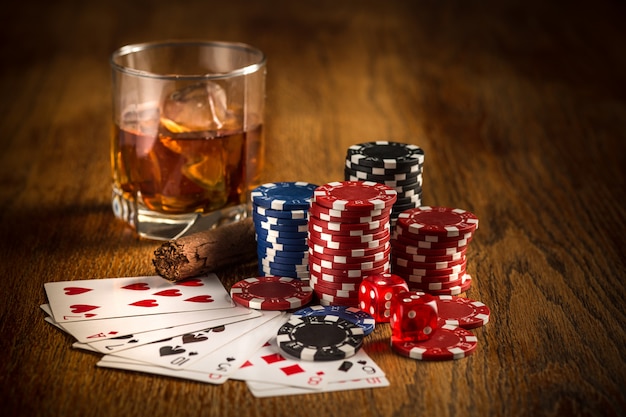 Free photo cigar, chips for gamblings, drink and playing cards