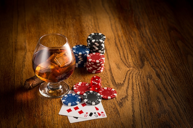 Free photo cigar, chips for gamblings, drink and playing cards