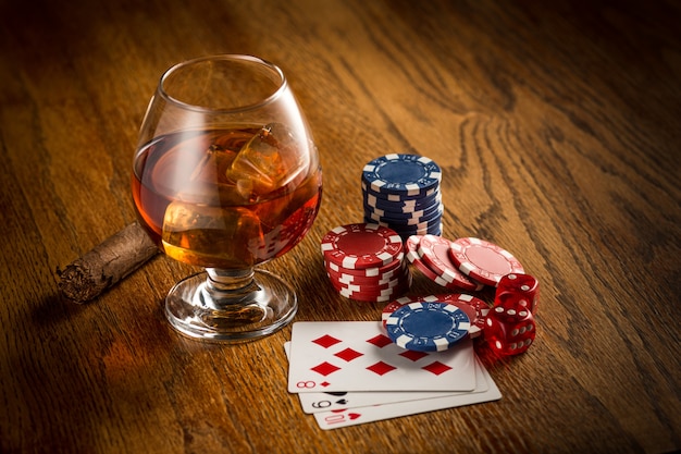 Free photo cigar, chips for gamblings, drink and playing cards