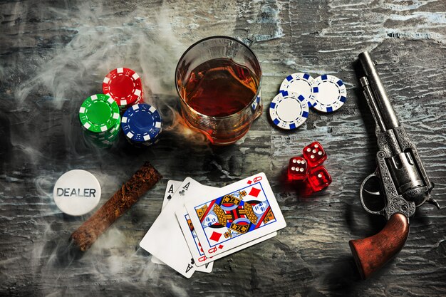 Cigar, chips for gamblings, drink and playing cards