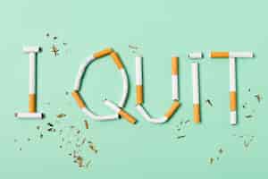 Free photo cigarettes assortment on green background