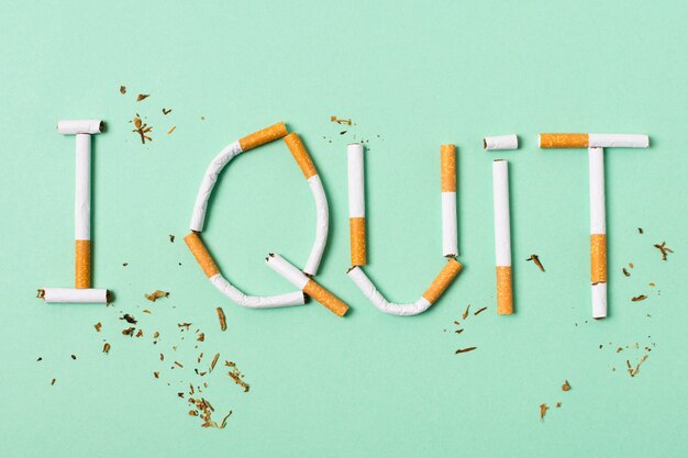 Cigarettes assortment on green background