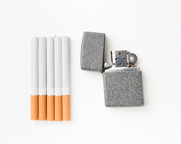 Cigarettes with lighter beside