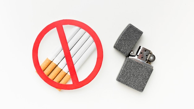 Free photo cigarettes with lighter message to stop habit