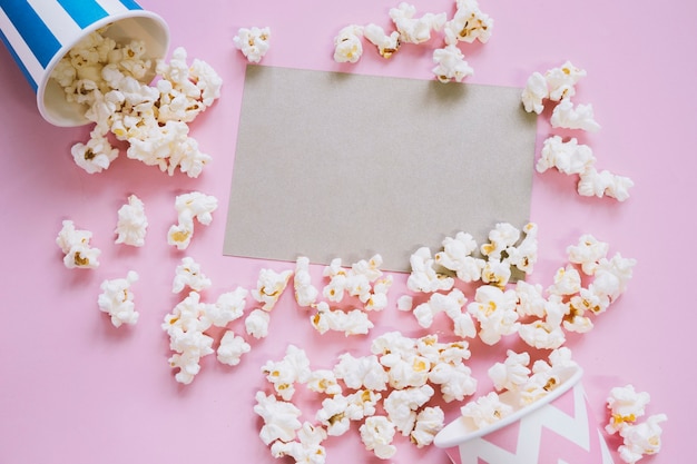 Cinema concept with popcorn around card