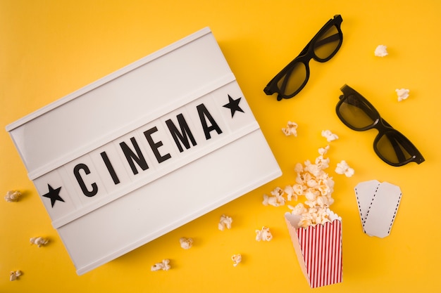 Free photo cinema lettering on yellow background