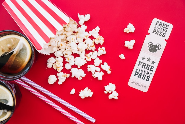 Free photo cinema popcorn box with a ticket