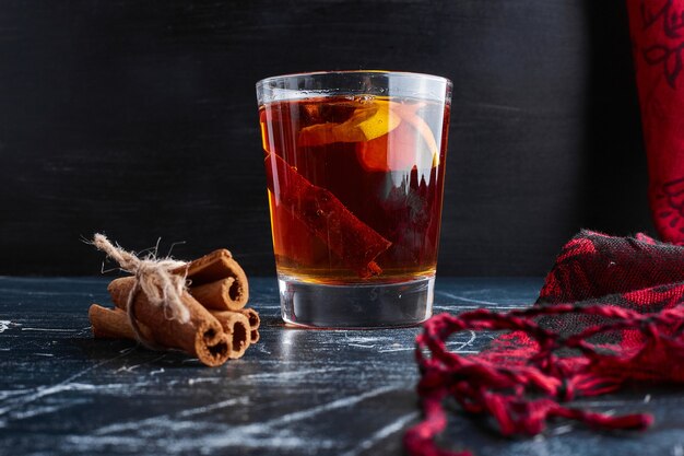 Cinnamon bunch with a glass of glintwine. 