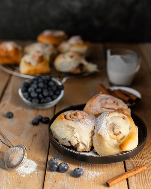 Cinnamon rolls and blueberries high angle