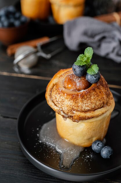 Cinnamon rolls with blueberries high angle