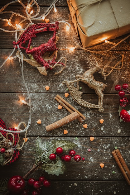 Free photo cinnamon sticks and cranberry on the table top view