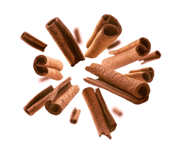 Free Photo cinnamon sticks levitate on a white background