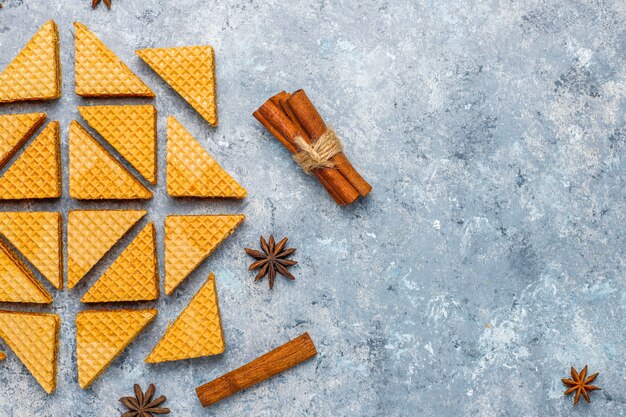 Cinnamon waffles on grey concrete background