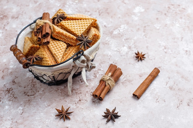 Free photo cinnamon waffles on grey concrete table, top view