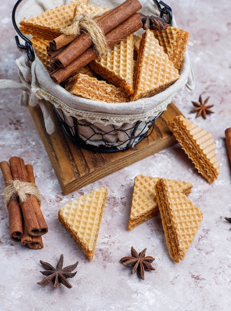 Free photo cinnamon waffles on grey concrete table, top view