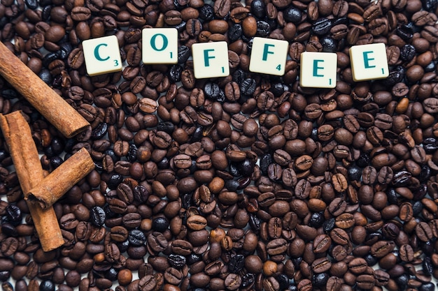 Cinnamon and writing on coffee beans