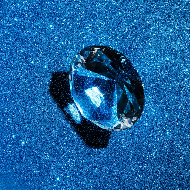 Circular diamond on glitter blue texture background