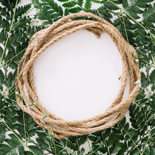 Circular floral composition with rope