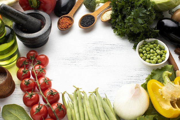 Circular frame with raw vegetables flat lay