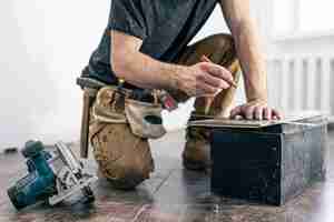 Free photo circular saw carpenter using a circular saw for wood