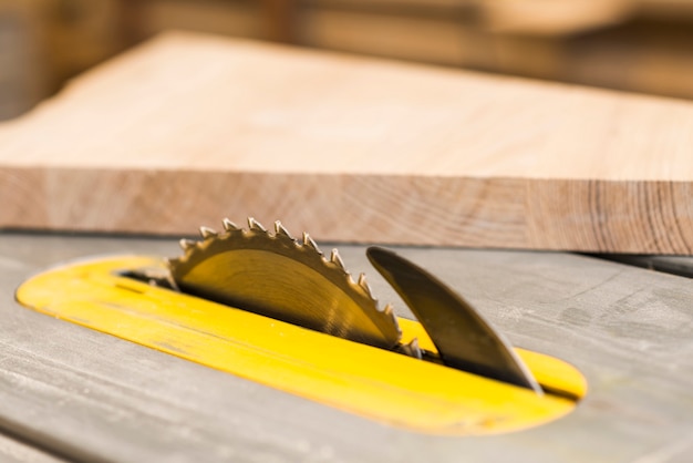 Circular sharp saw in wooden table