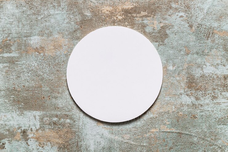 Free Photo circular white frame on old wooden desk