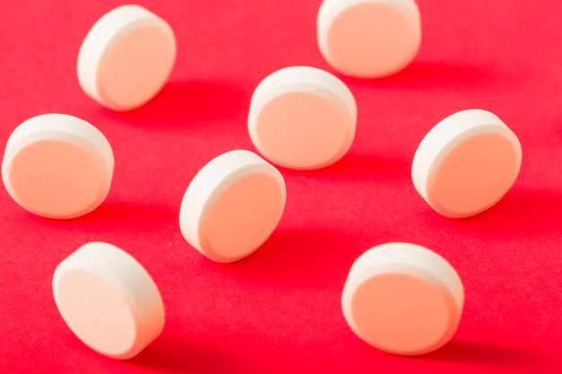 Circular white pills over the bright background