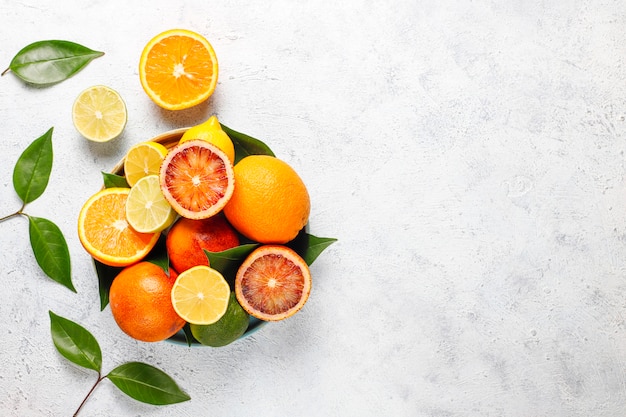 Citrus background with assorted fresh citrus fruits